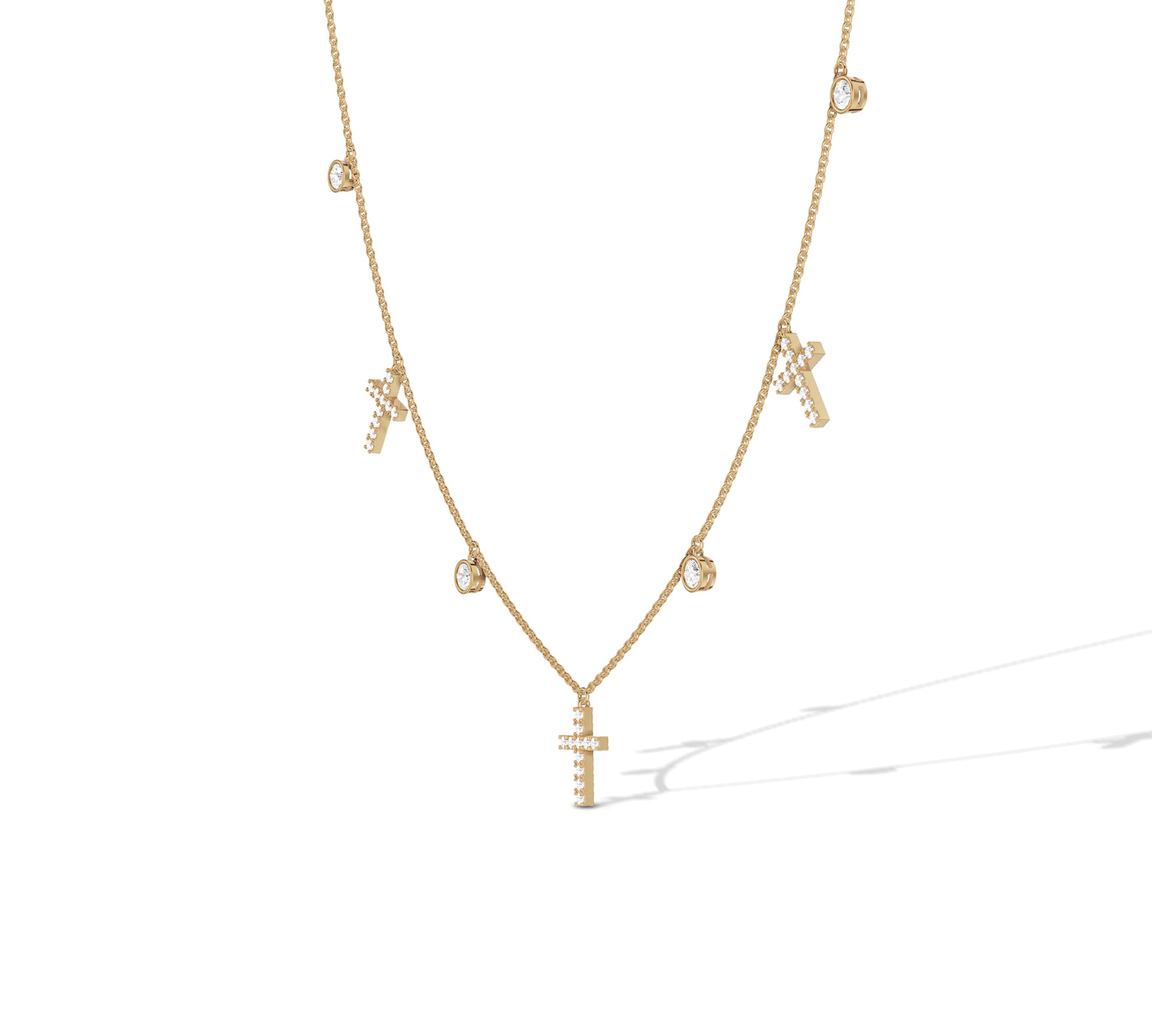 Dainty yellow gold necklace with diamond bezel and cross charms