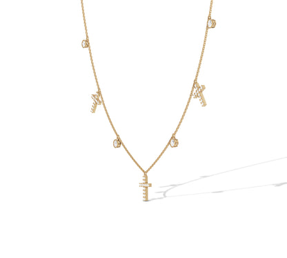 Dainty yellow gold necklace with diamond bezel and cross charms
