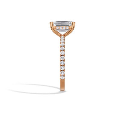 Elegant emerald solitaire in rose gold band