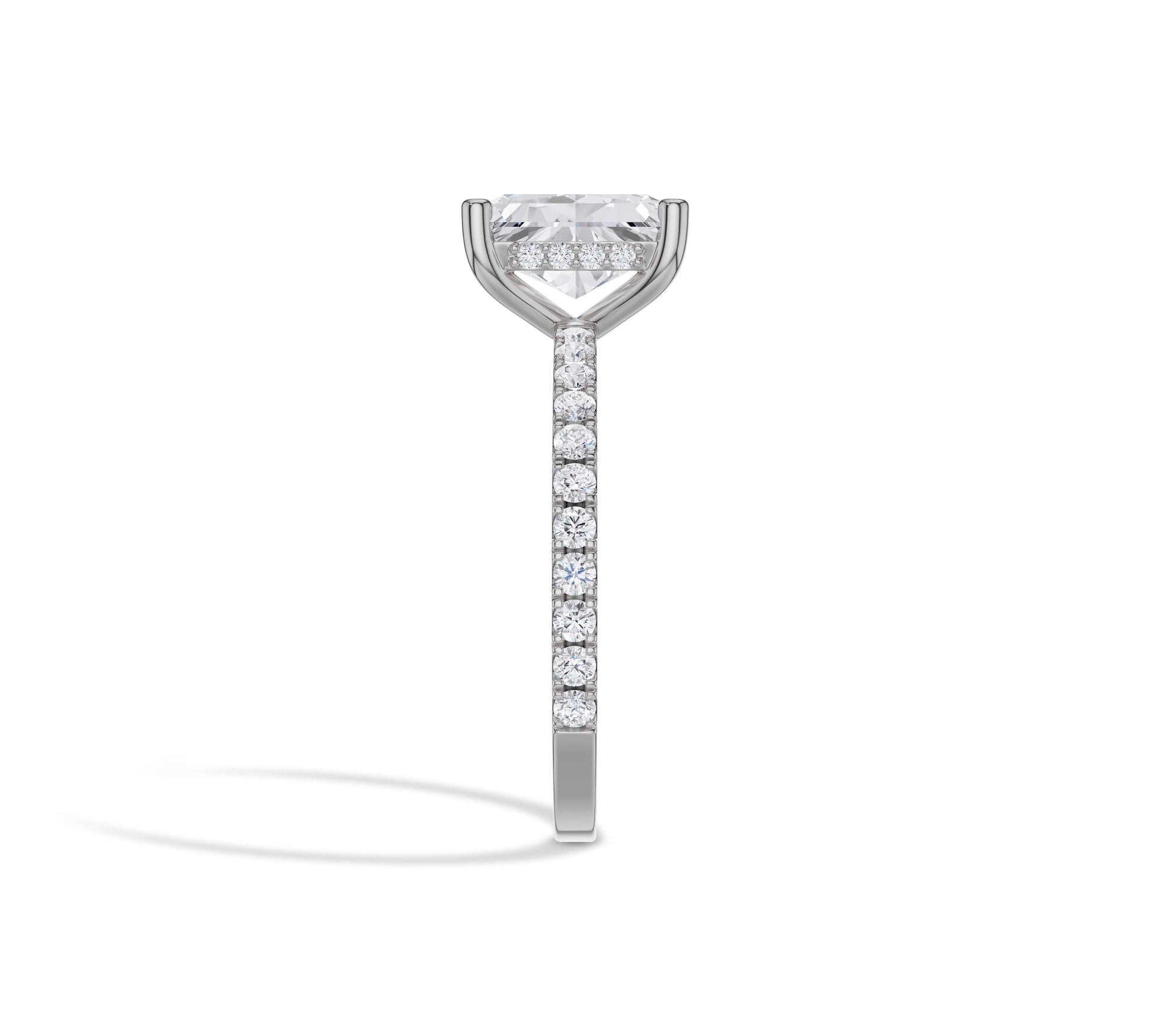Radiant solitaire in white gold with pavé band and hidden halo