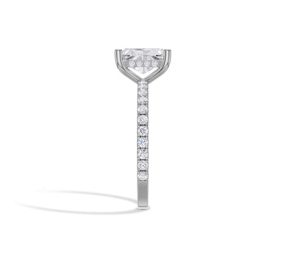 Radiant solitaire in white gold with pavé band and hidden halo