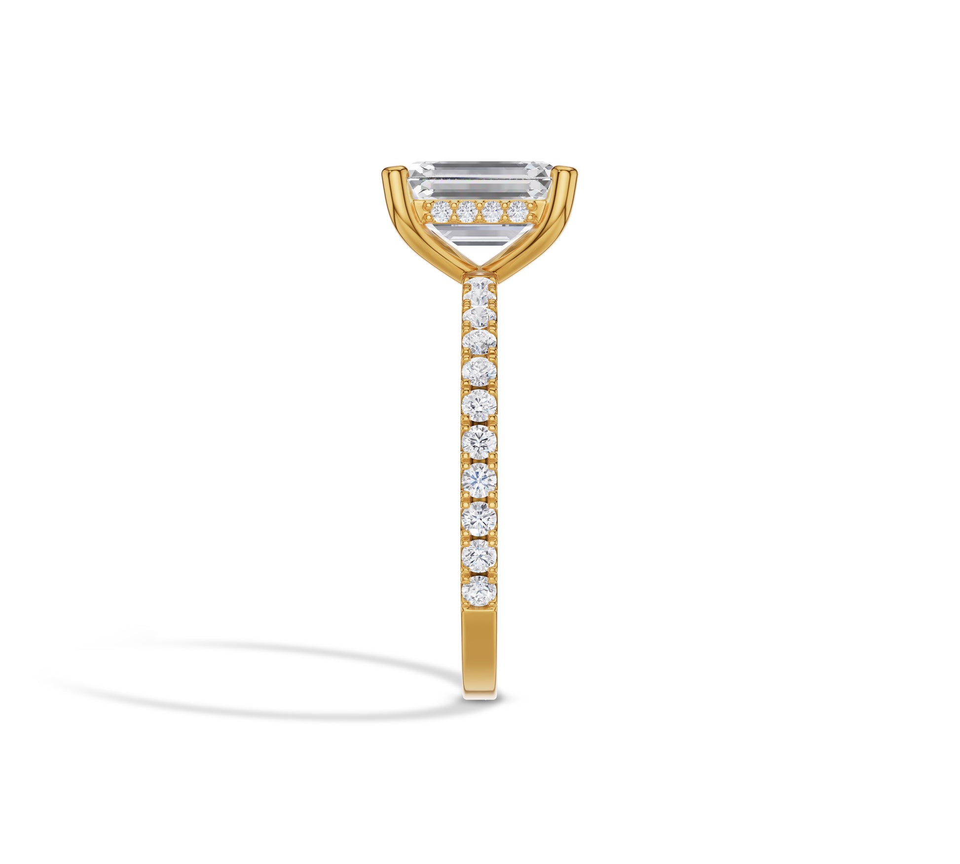 Yellow gold ring with emerald center diamond