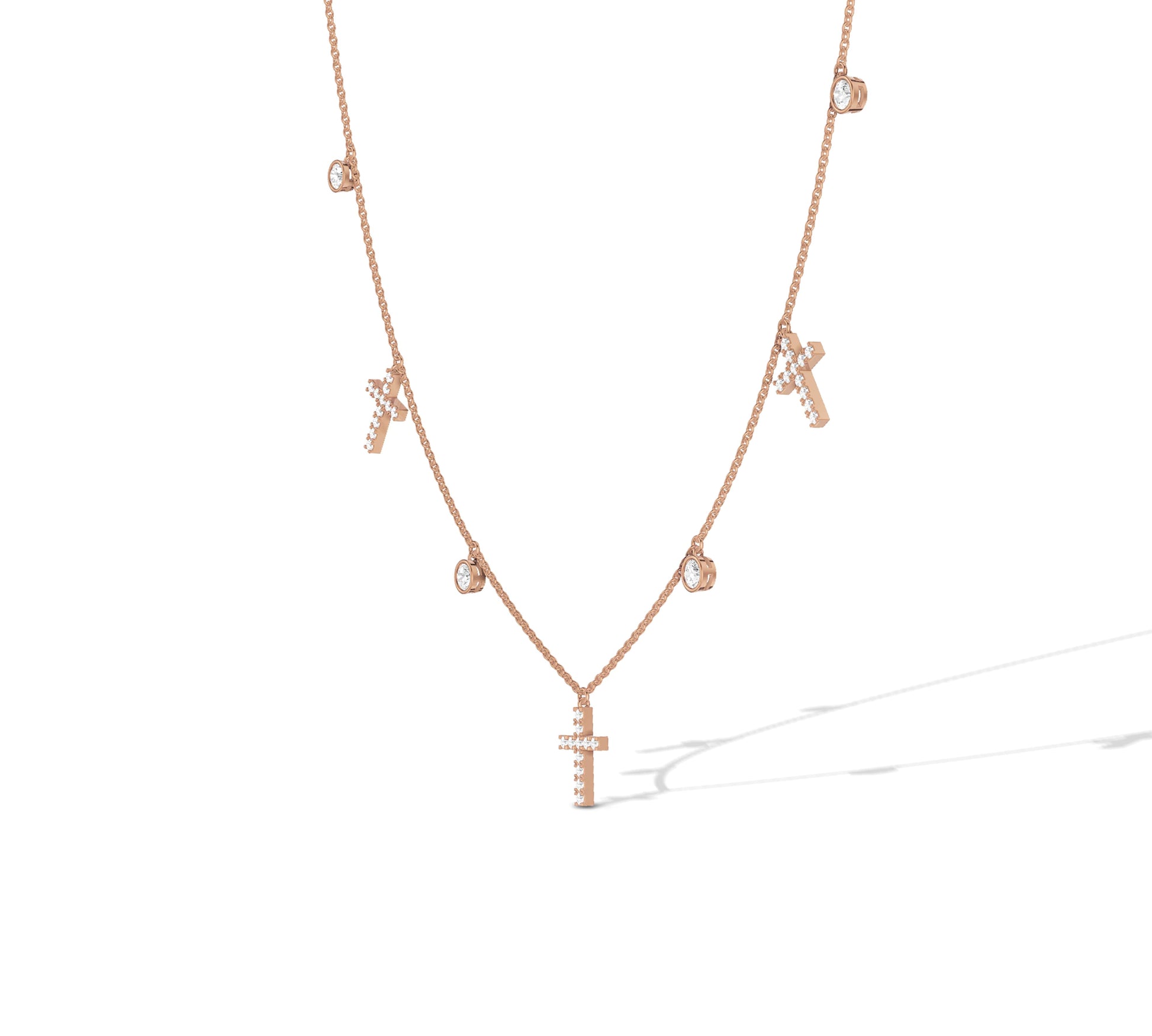 Delicate rose gold chain with cross and bezel details