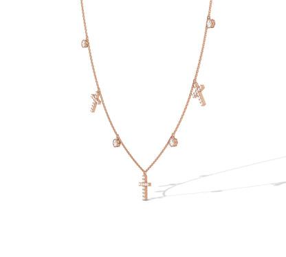 Delicate rose gold chain with cross and bezel details
