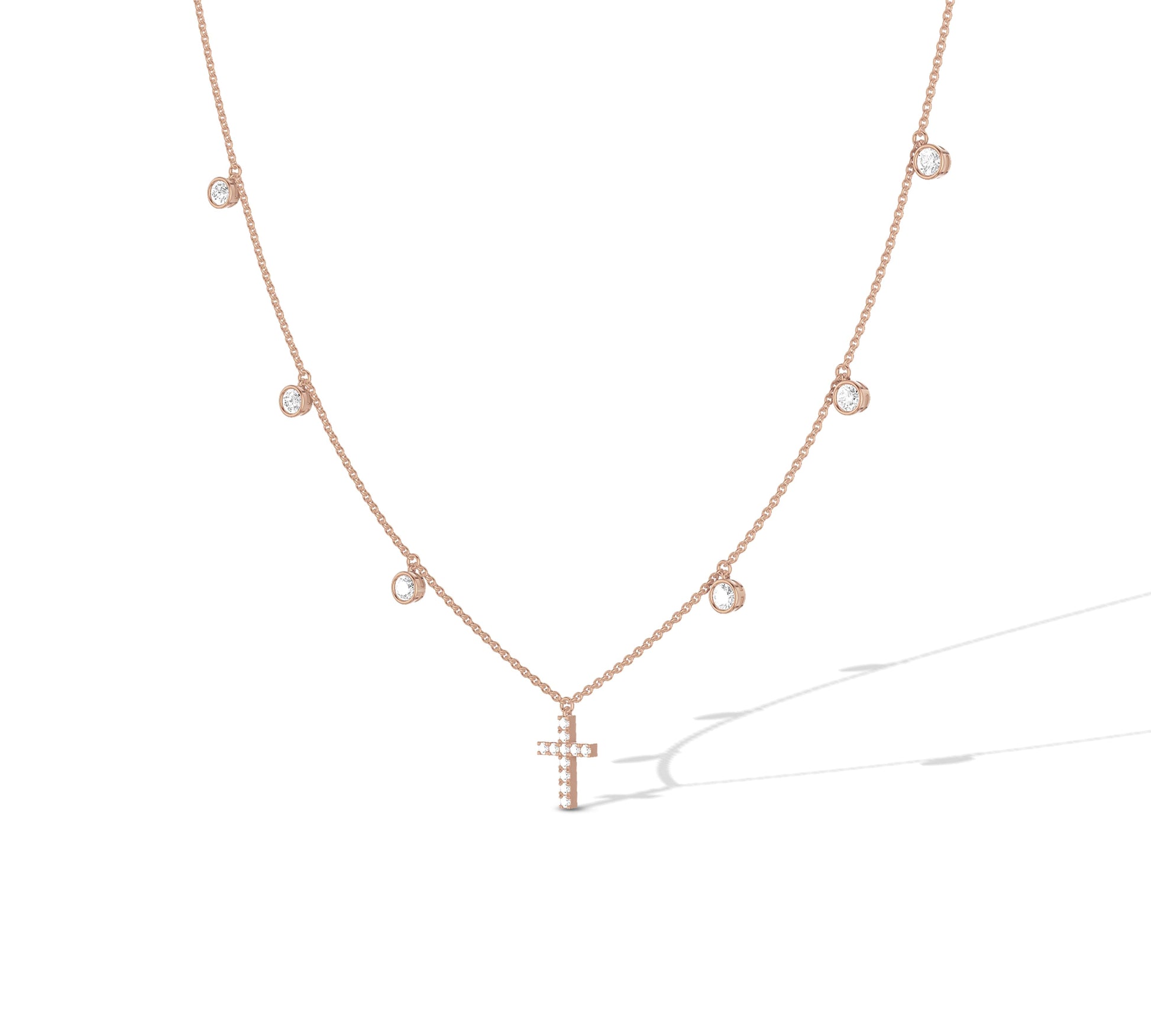 Elegant rose gold charm necklace with cross centerpiece