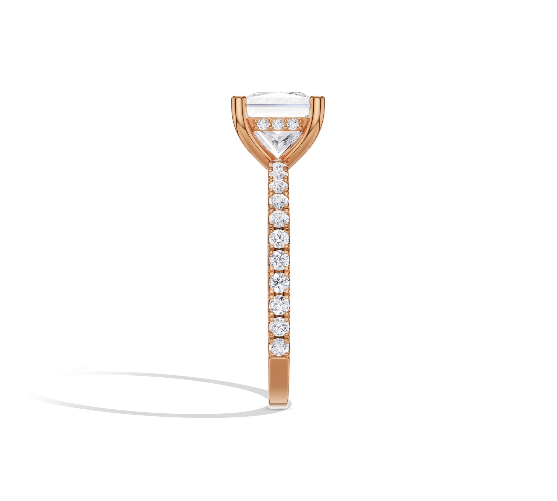 Princess solitaire in 14K rose gold with pavé accents