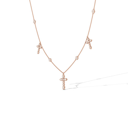 Feminine rose gold cross necklace with floral sparkle