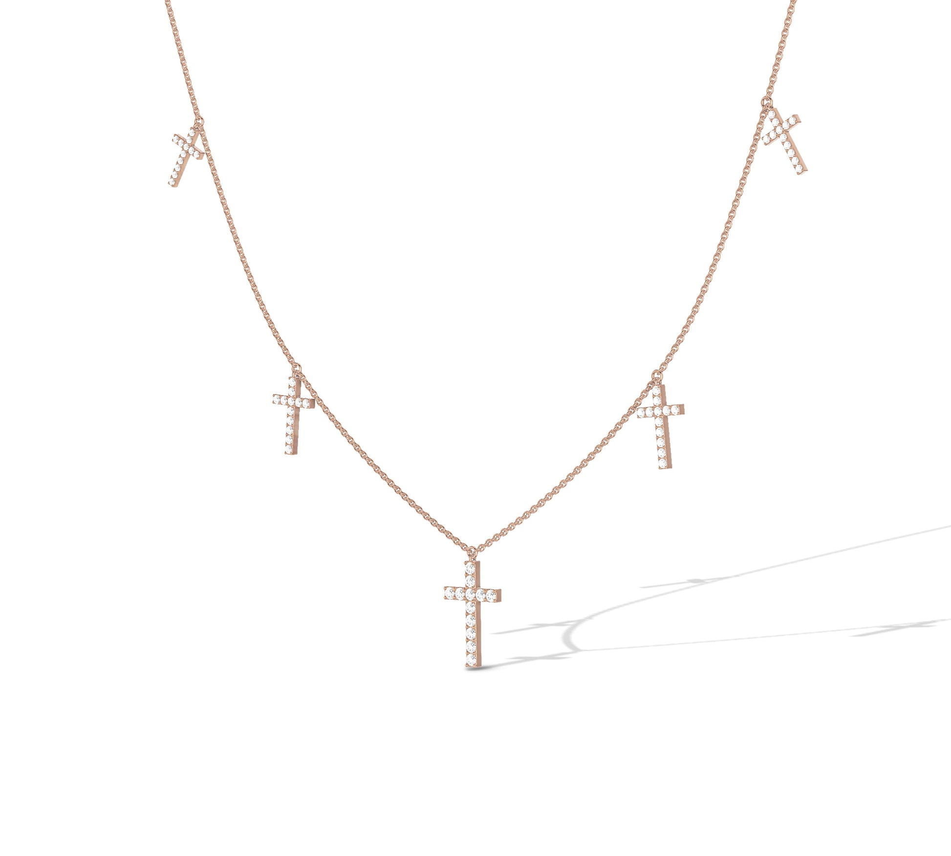rose gold necklace with diamond-encrusted crosses