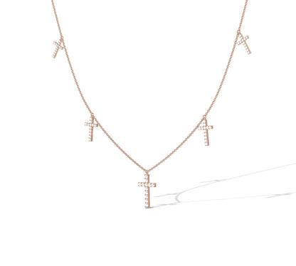 rose gold necklace with diamond-encrusted crosses