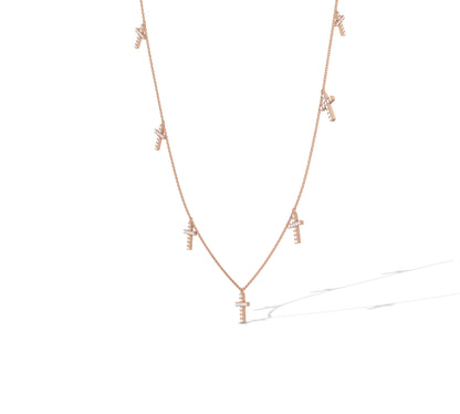 Stylish 14K rose gold multi-cross drop necklace
