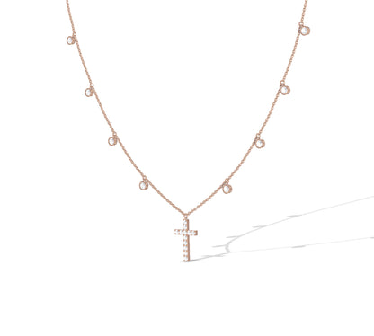 Gold chain with floating bezel diamonds and cross