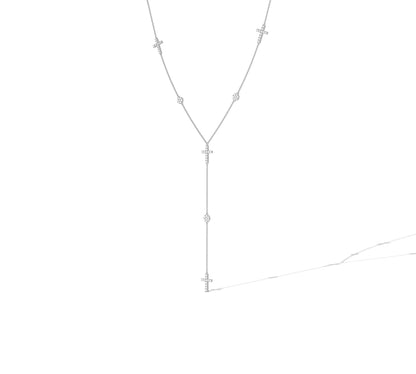 Elegant white gold lariat with cross and diamond details