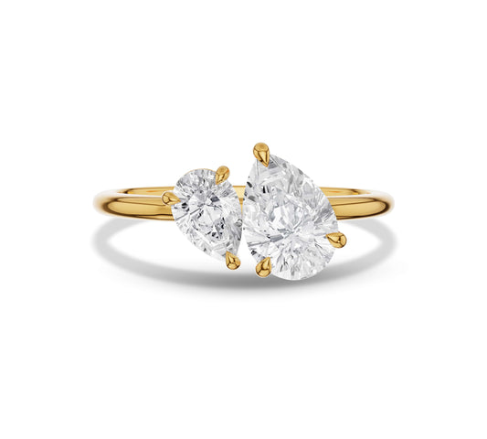 Yellow gold open ring with large and small pear shaped diamonds