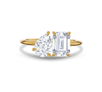 Yellow gold open band with pear and emerald shaped diamonds