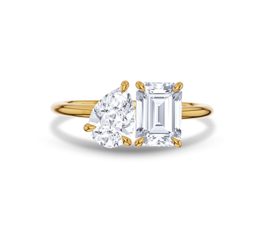 Yellow gold open band with pear and emerald shaped diamonds