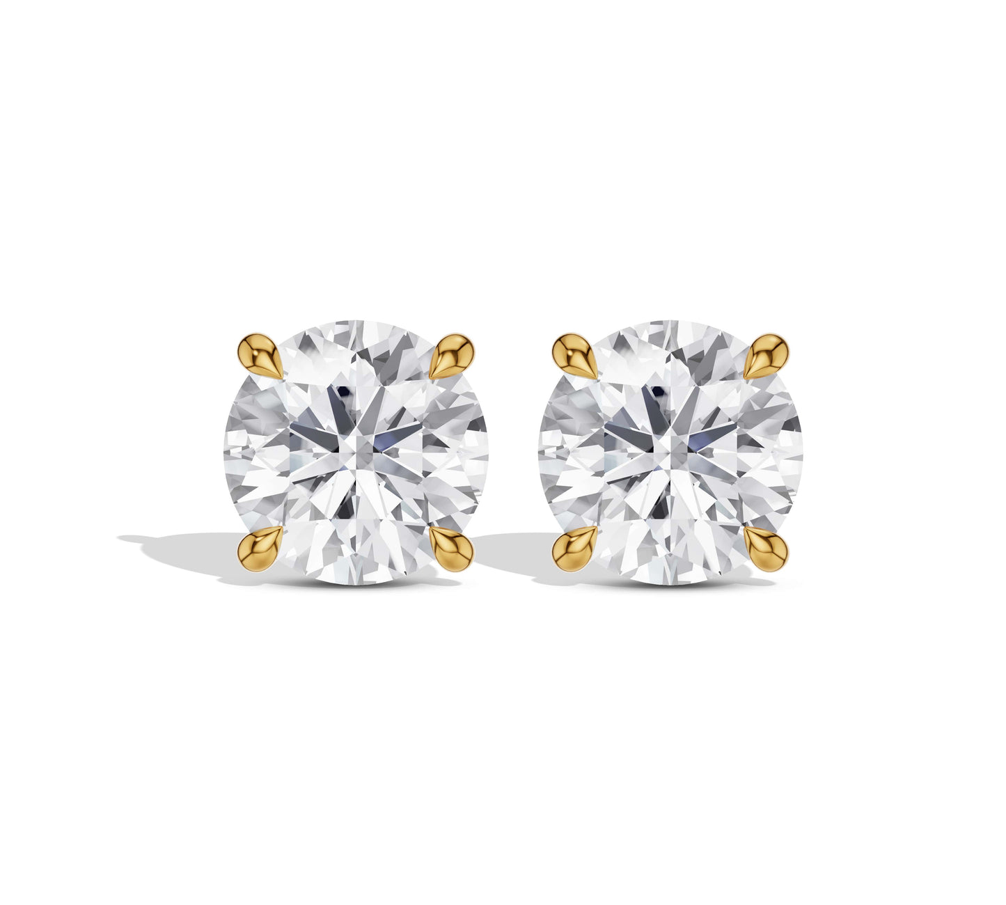 Round diamond earrings in yellow gold