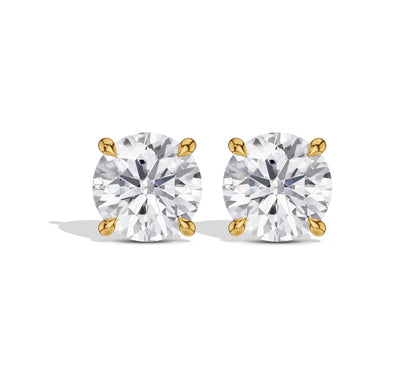 Round diamond earrings in yellow gold