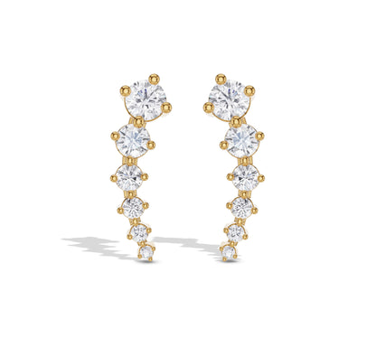 Long graduated diamond earrings in yellow gold