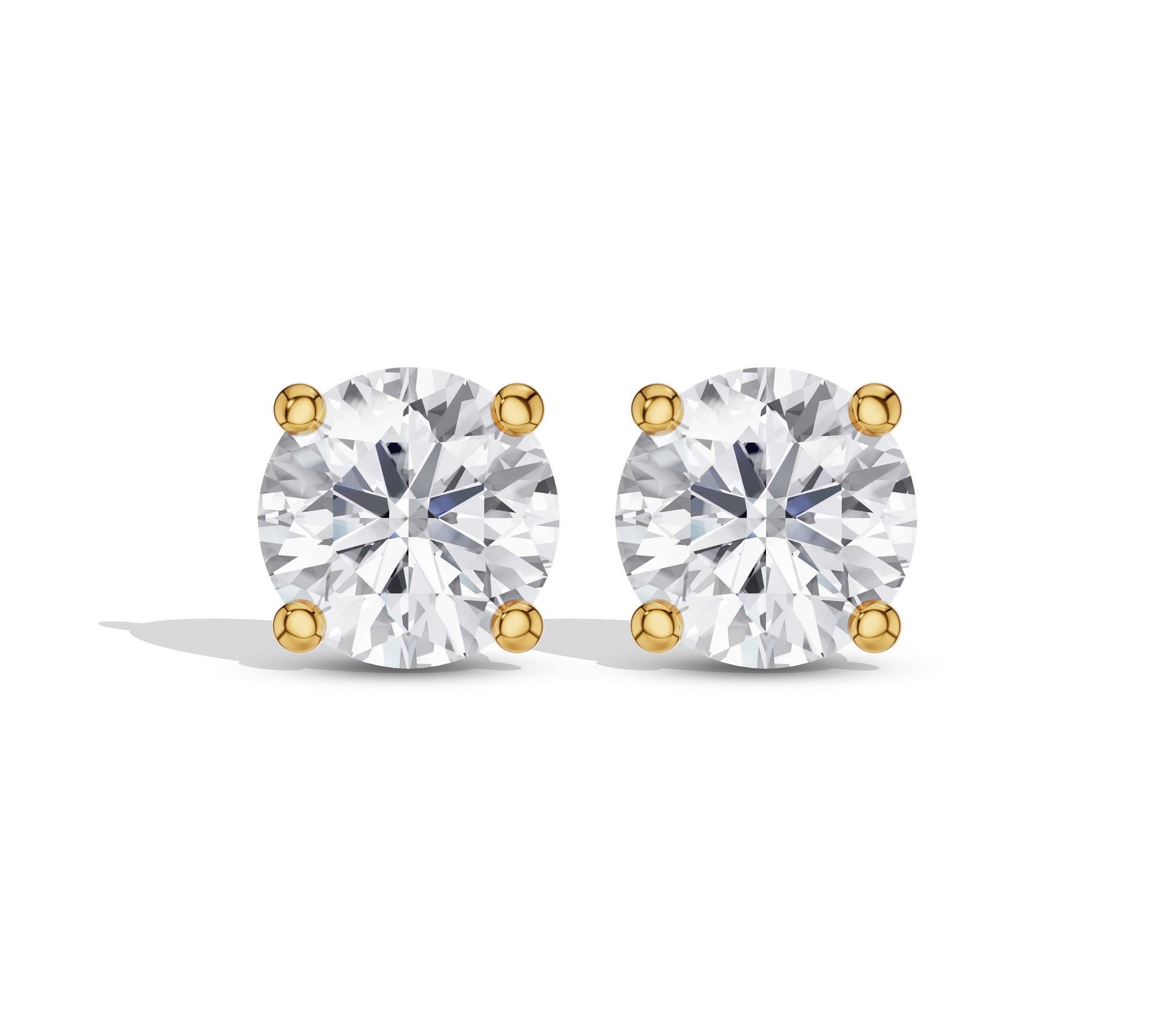 Round cut diamond studs yellow gold