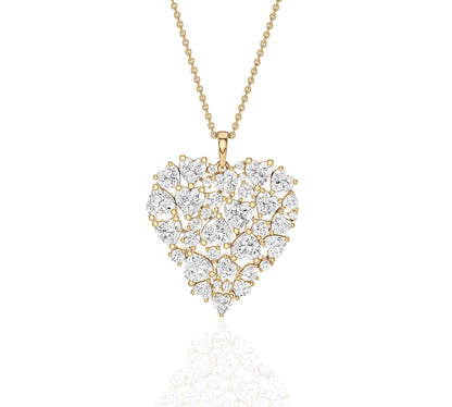 Close-up of heart-shaped cluster diamond pendant on gold chain