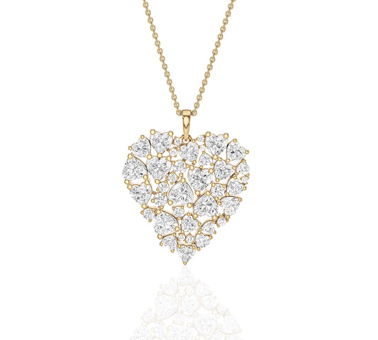 Close-up of heart-shaped cluster diamond pendant on gold chain