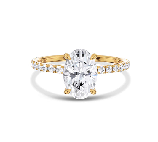 Oval lab grown diamond ring with yellow gold pave setting