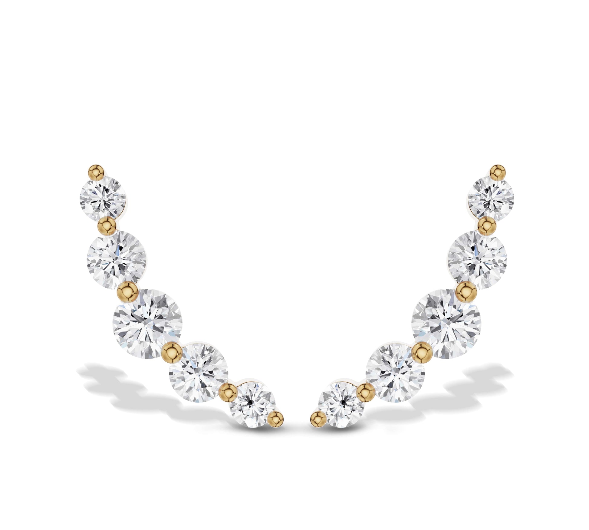 Graduated diamond climber earrings in yellow gold