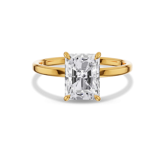 Solitaire radiant cut diamond ring with polished gold band