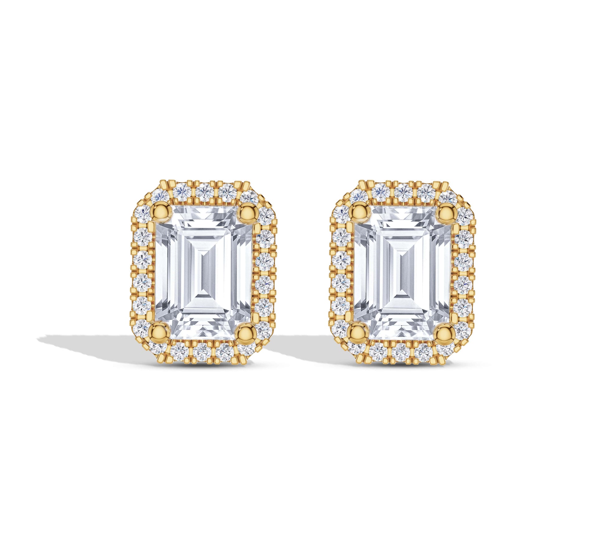 Emerald cut halo diamond earrings in yellow gold
