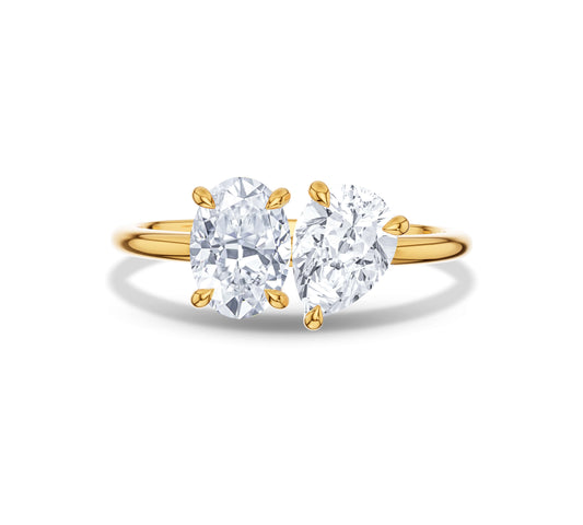Classic yellow gold Toi et Moi ring with oval and pear cuts