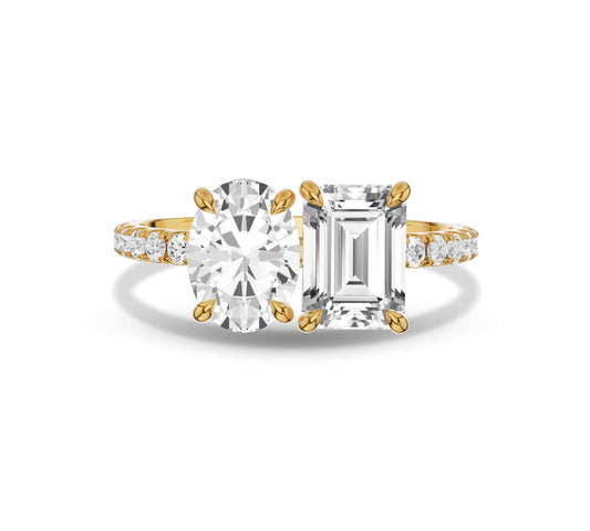 Yellow gold Toi et Moi diamond ring with oval and emerald cuts and pave band