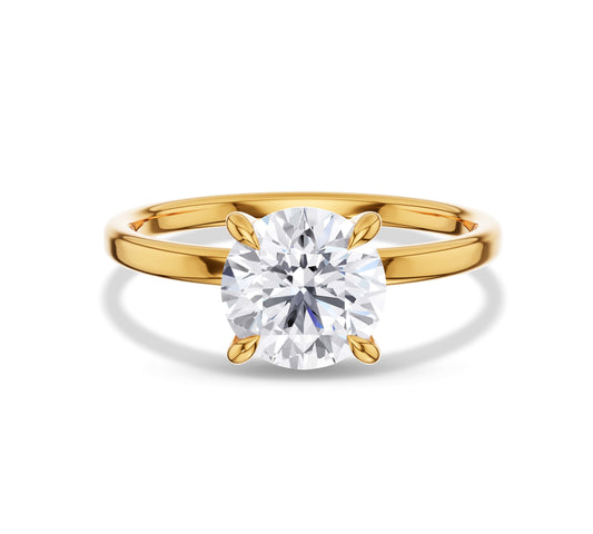 Yellow gold solitaire ring with round diamond center