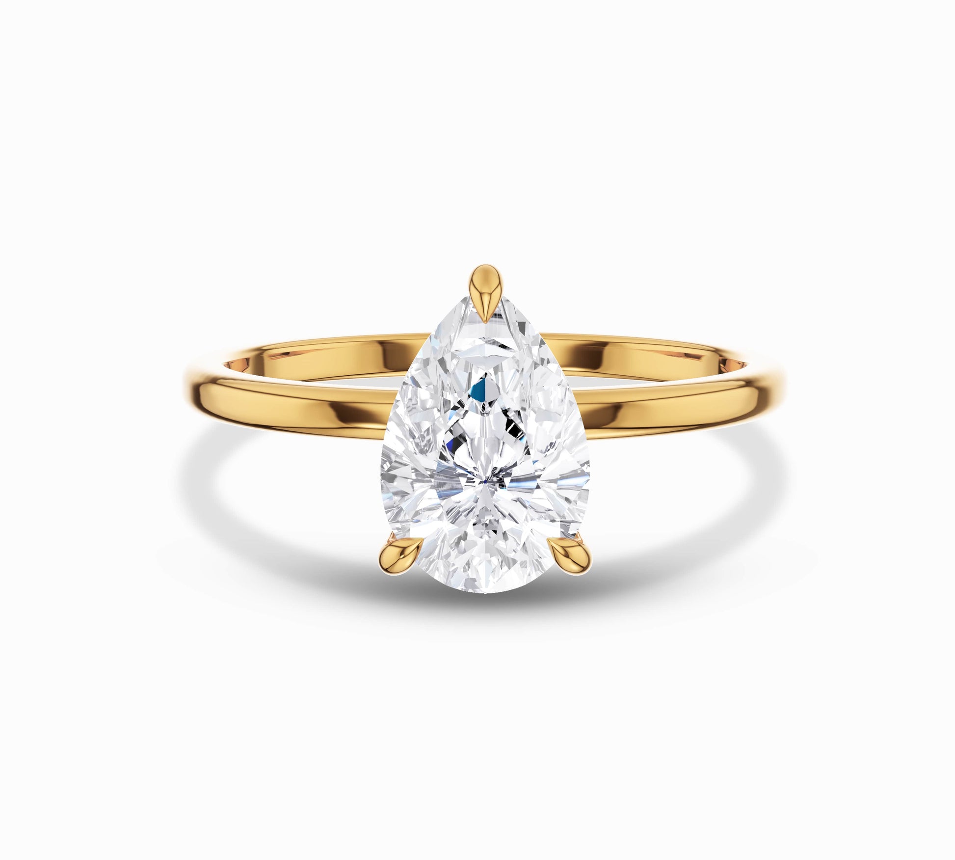 Pear cut solitaire diamond ring in yellow gold