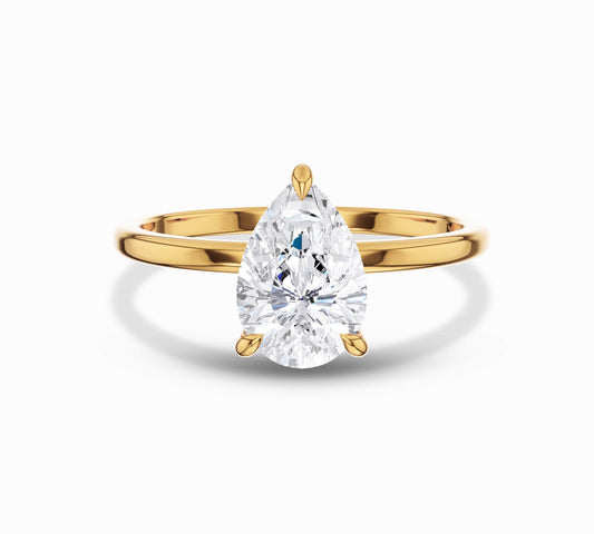 Pear cut solitaire diamond ring in yellow gold