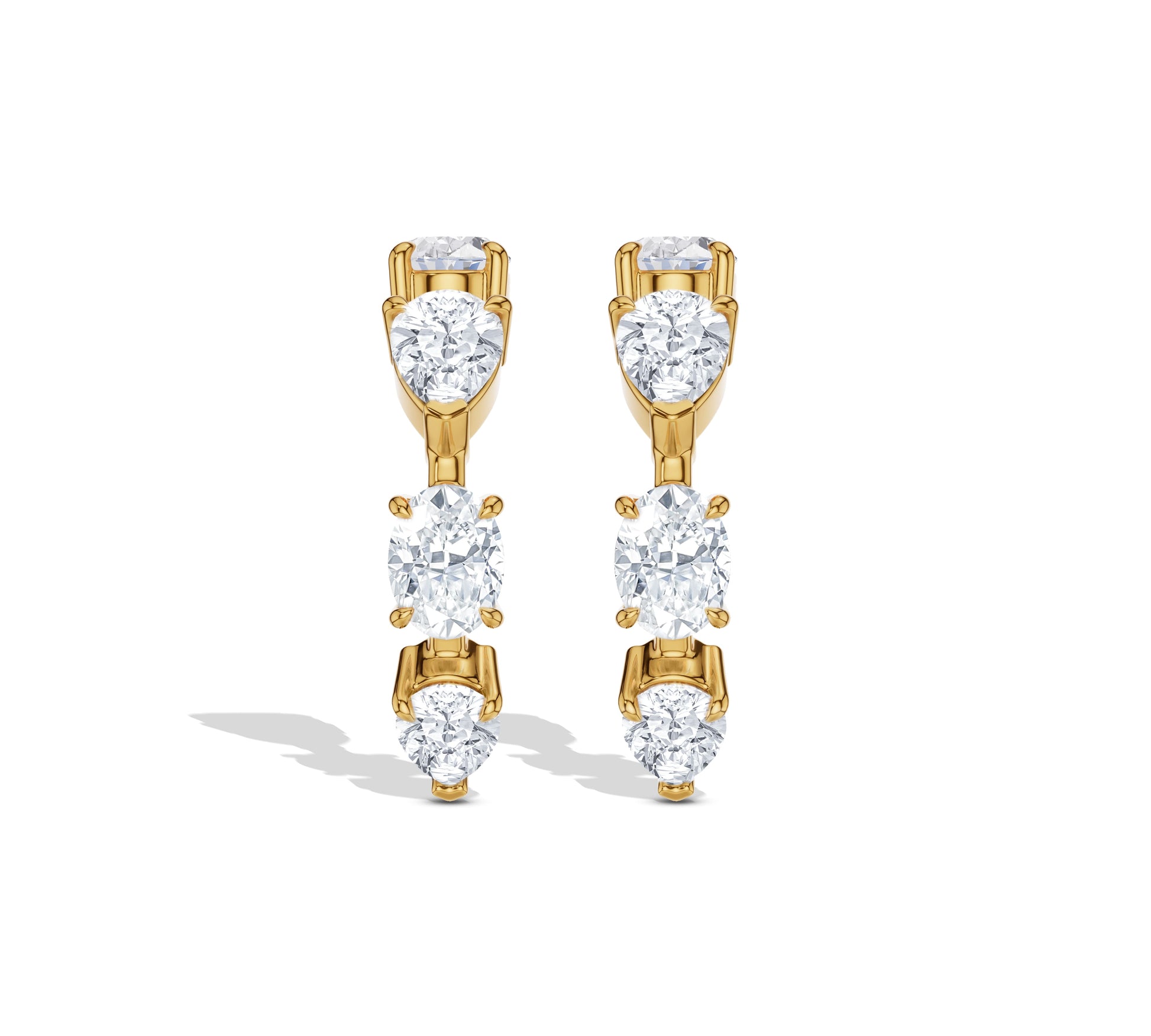 Curved crawler earrings with oval and round diamonds