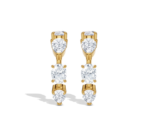 Curved crawler earrings with oval and round diamonds