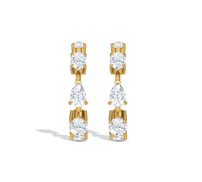 Hoop earrings featuring pear and oval diamonds