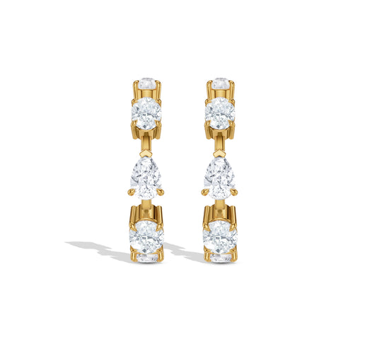 Hoop earrings featuring pear and oval diamonds