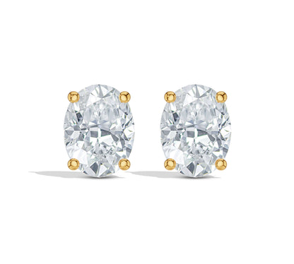 Oval diamond studs with four-prong gold setting