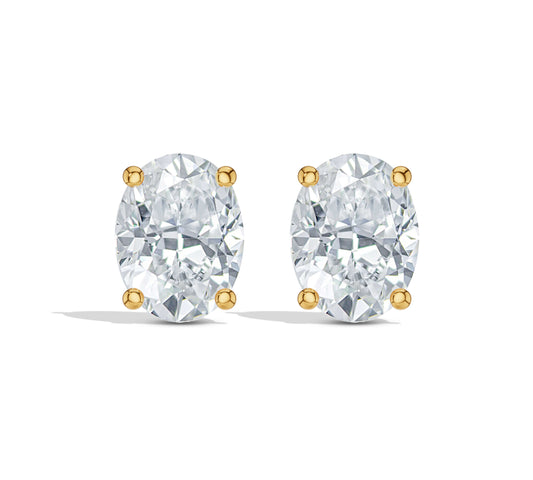 Oval diamond studs with four-prong gold setting