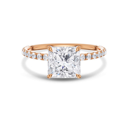 Rose gold pear cut diamond ring with pavé side stones