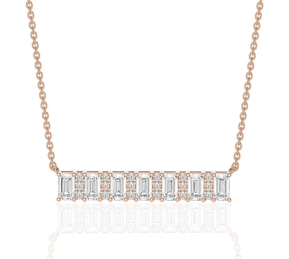 Symmetrical bar of emerald and round diamonds
