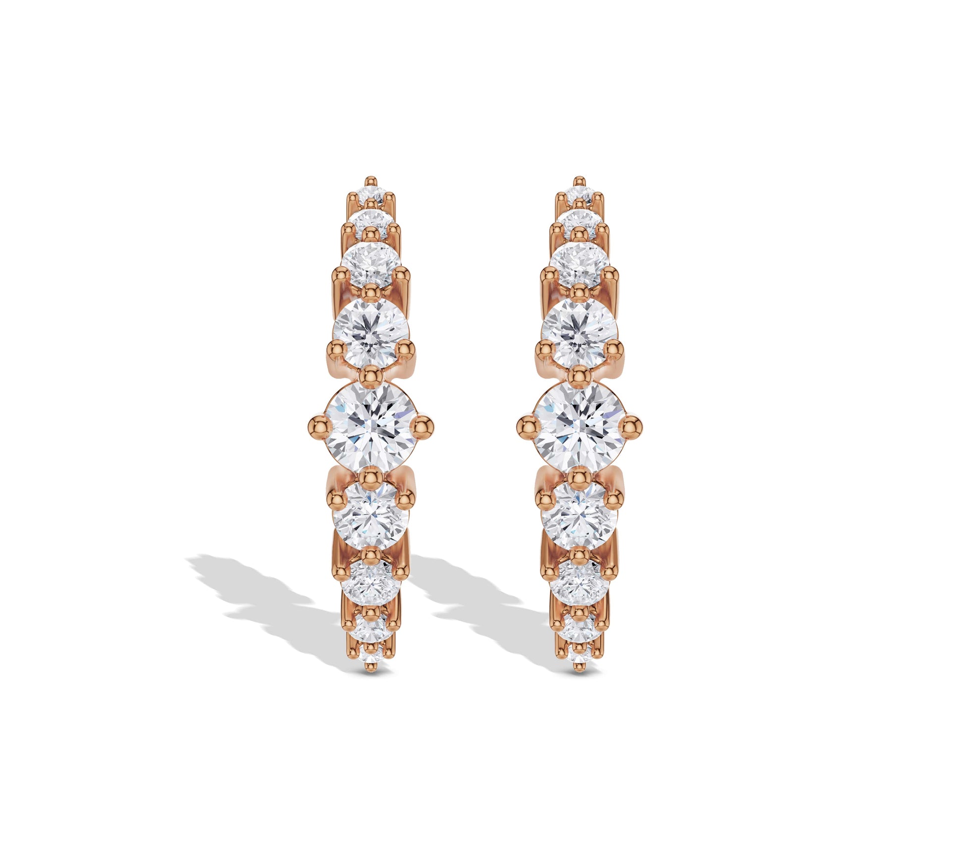 Rose gold huggie hoop earrings with round diamonds
