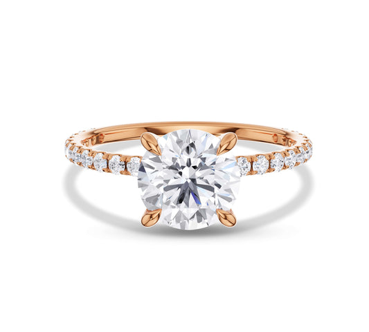 Classic engagement ring featuring a round center stone