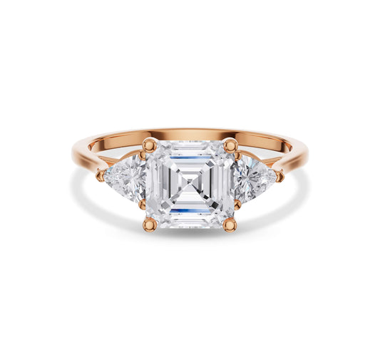 Rose gold Asscher cut three-stone engagement ring