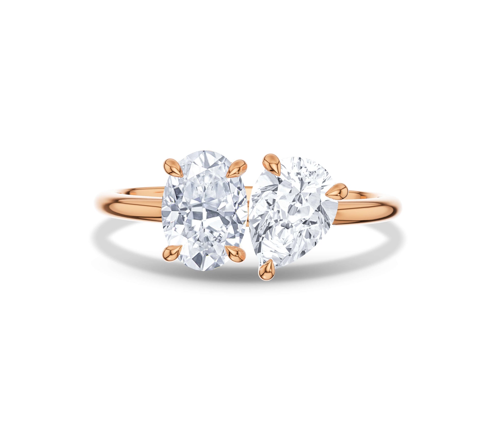 Rose gold Toi et Moi ring featuring oval and pear moissanite stones