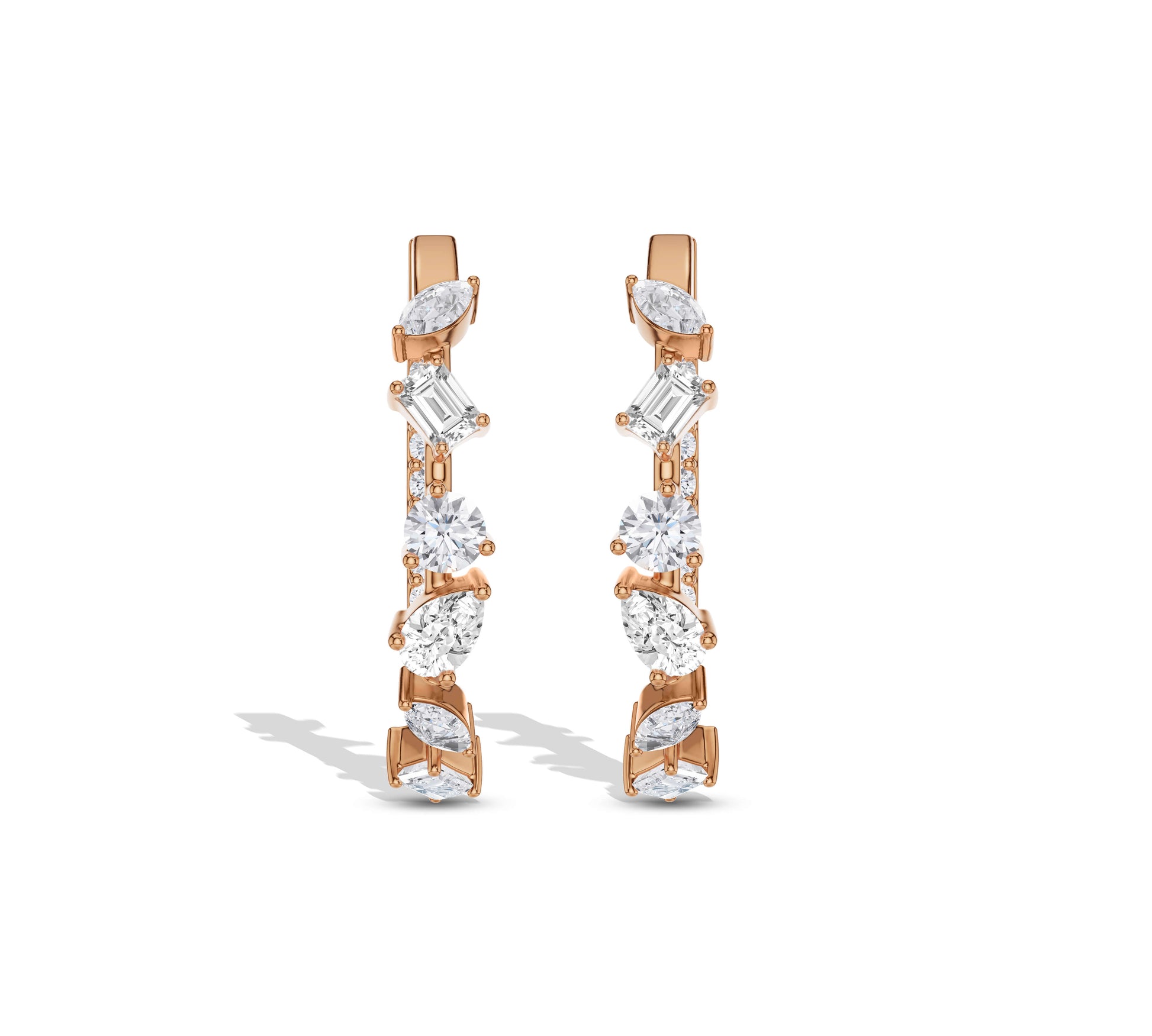Gold hoops featuring marquise, baguette, and round diamonds