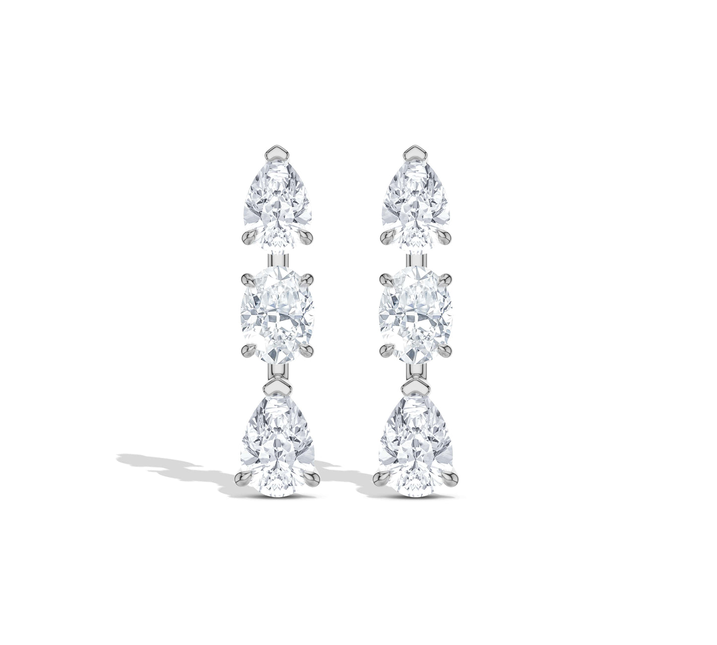 Delicate gold drop earrings with three sparkling stones