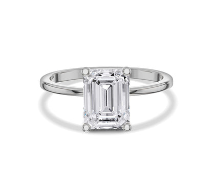 engagement ring with emerald solitaire