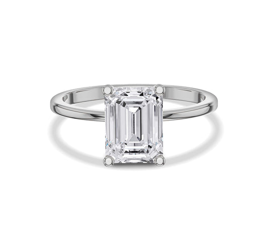 engagement ring with emerald solitaire